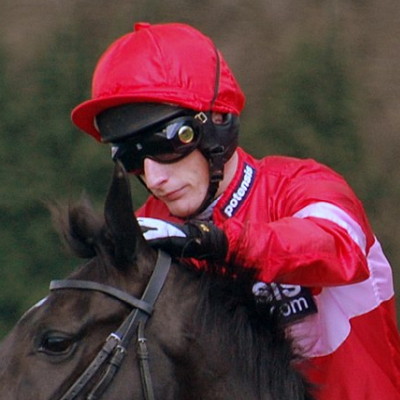 Daryl Jacob on horse, wearing sun glasses