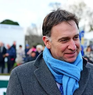 Henry de Bromhead trainer wearing light blue scarf