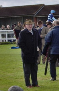 Martin Pipe standing in a parade ring