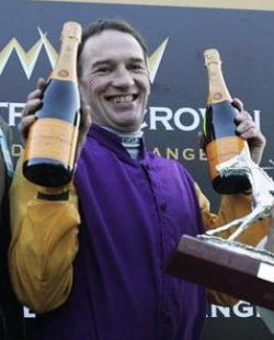 Paul Carberry holding bottles of champagne 