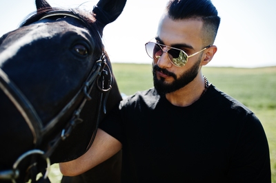 Footballer Stroking Horse