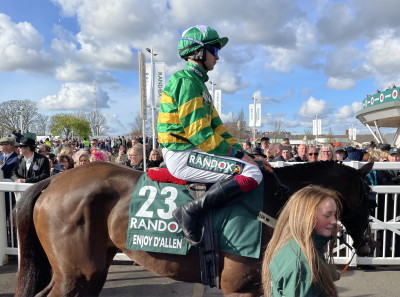 grand national 2022 horse with jockey walking to track
