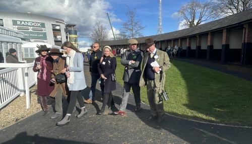 People clustered together in pre parade ring