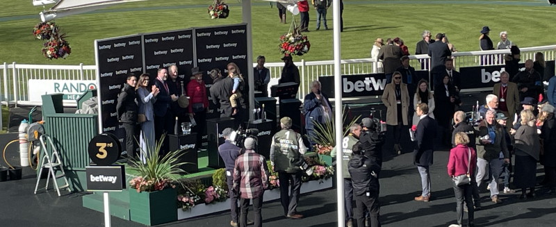 Winners enclosure trophy ceremony with trainers
